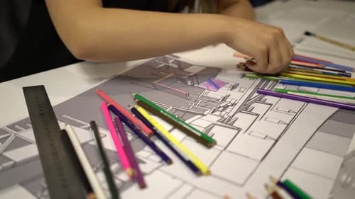 Woman Drawing Design with Pencils and Ruler