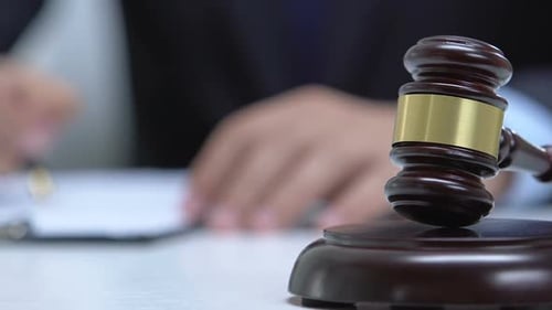 Male Lawyer Working With Court Document, Gavel on Table, Justice Concept