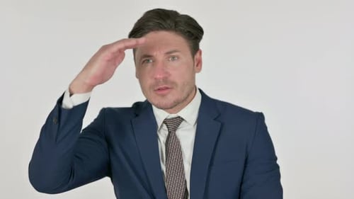 Businessman Looking into Distance Wearing Blue Suit