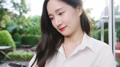 Woman Using Smartphone and Puts On Face Mask