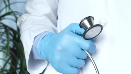 Close Up of Doctor Hand Using Stethoscope.