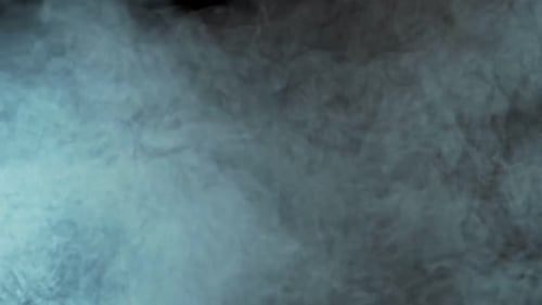 Swirling Teal Fog Against Black Background