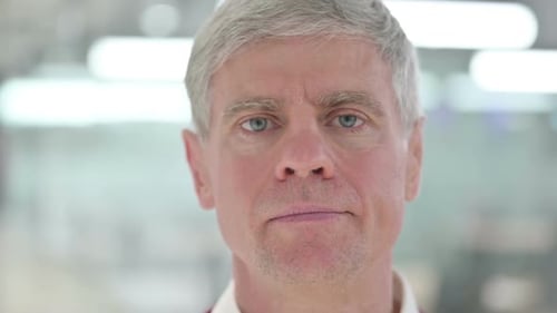 Close Up of Mature Adult Looking at Camera