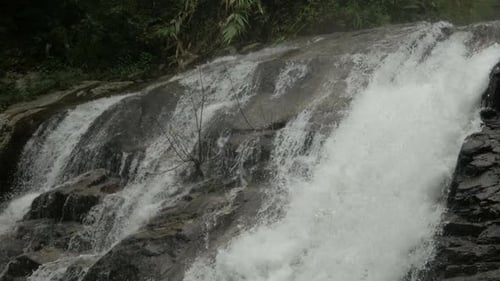 Scenic Waterfall Cascading Over Rocks in Nature