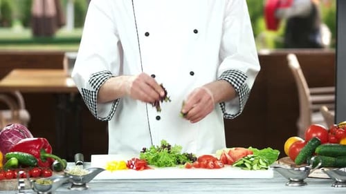 Chef Preparing Fresh Salad Ingredients Outdoors