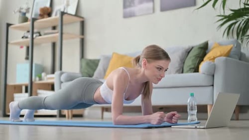 Woman Doing Plank Exercise at Home