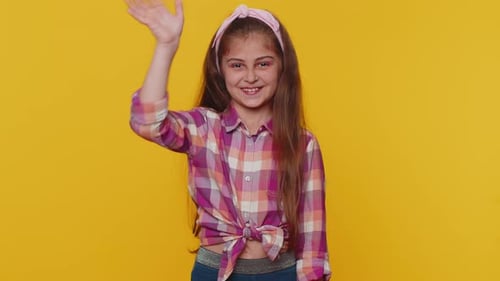 Happy Child Girl Kid Smiling Friendly at Camera Waving Hands Gesturing Hello Hi Greeting Goodbye