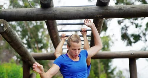 Couple Doing Outdoor Workout on Obstacle Course