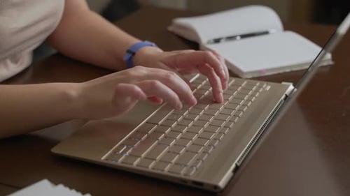 Typing on Laptop at Home Office Desk