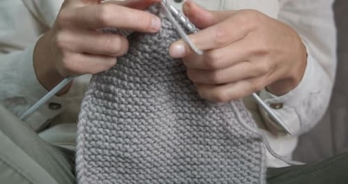Woman Knitting Grey Fabric Close Up