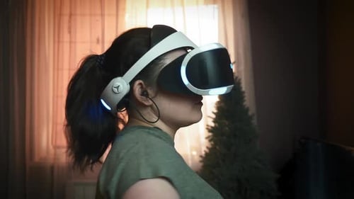 Woman Playing VR Game With Controllers at Home