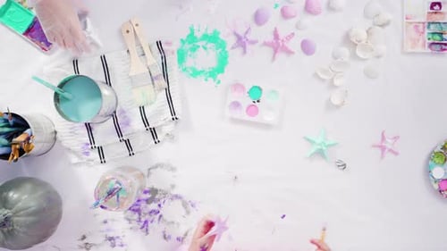 Flat lay. Step by step. Painting craft pumpkin with acrylic paint to create decorated mermaid Hallow