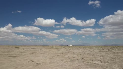 Orbiting White Pickup In Middle Of Plains
