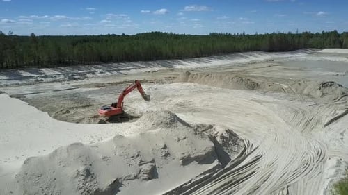 Sand Pit with High Hills and Red Digger in Summer Upper View