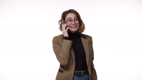 Excited Young Woman Celebrates Good News on Phone