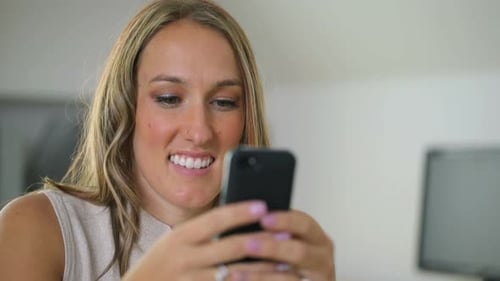 Businesswoman using mobile phone in office