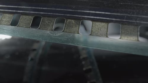 Close-up of Film Moving Through the Camera