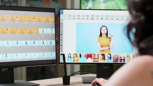 Graphic Designer Editing Photos on Dual Monitors