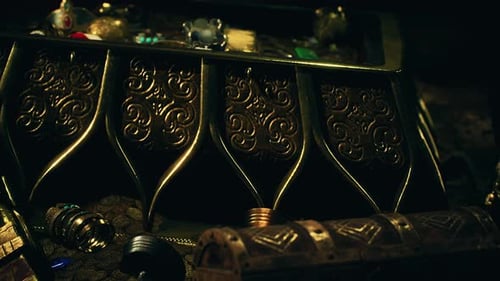 Treasures in a Dark Cave with Coins Diamonds and Gold