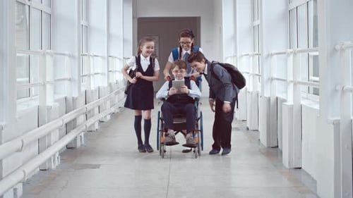 Handicapped Schoolboy Chatting with Friends
