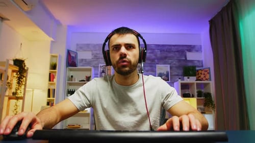 Young Man Playing Video Games and Winning