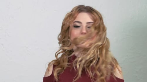 Beautiful Woman Shaking Her Blonde Wavy Hair