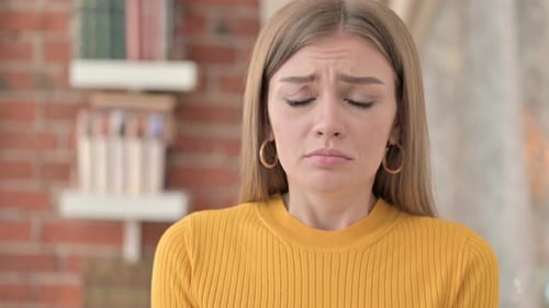 Distressed Young Woman Looking Anxious and Upset