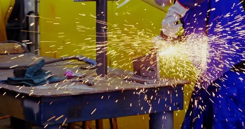Male engineer using grinder machine 4k