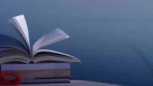 Books on table Outdoors. Reading on Holidays