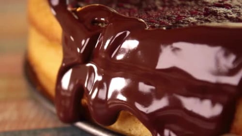Chocolate Sauce Poured on a Delicious Layer Cake