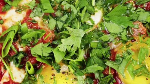 Close-up of Eggs with Sauce and Herbs