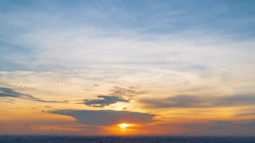 Sunset Time-Lapse over City at Twilight