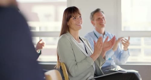 Adults Clapping at a Business Conference