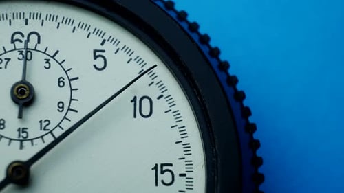 Close up of Mechanical Timer Against Blue Background