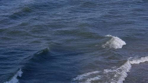 Small river waves along the banks