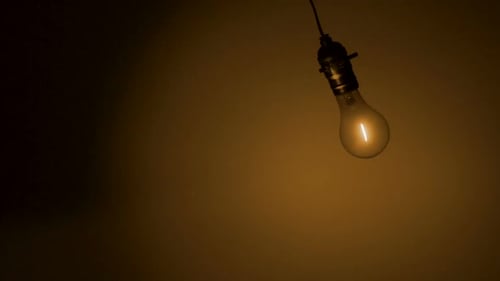 Light bulb hanging in the air, Slow Motion