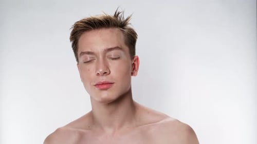 Model Face Handsome Man Looking at Camera Confusion Closeup White Background