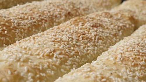 Fresh Baked Bread Rolls Sprinkled with Sesame Seeds