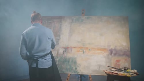 Artist's Workshop Creative Person at Work a Talented Adult Man Artist Covers the Canvas with Beige