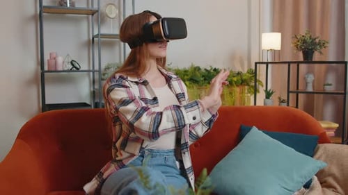 Woman Experiencing Virtual Reality on Living Room Couch