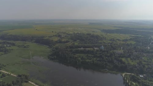Aerial View of Tranquil Farmland and River