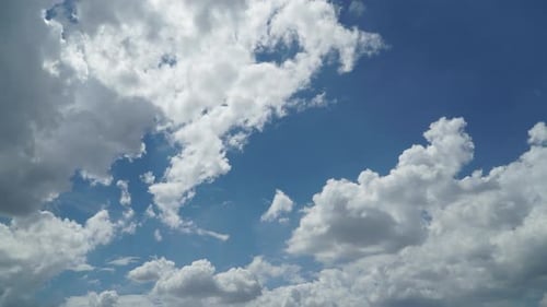 Clouds Moving Across a Blue Sky