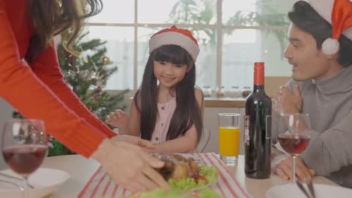 Family Celebrates Christmas at Home with Festive Meal