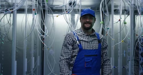 IT Technician Working in a Data Center Server Room