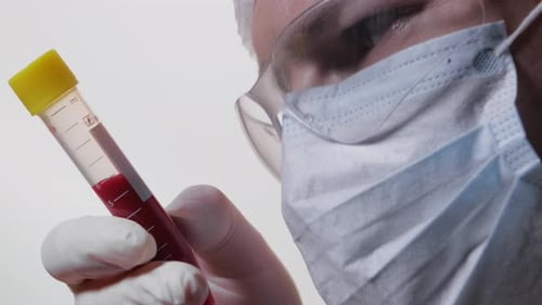Close-up of a Doctor Holding a Blood Sample