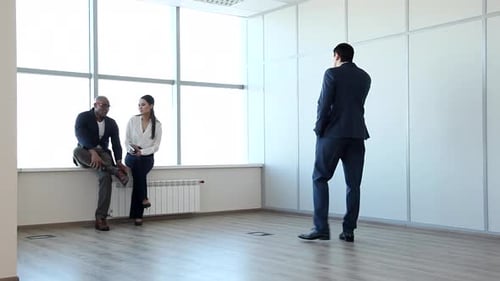 Business Professionals Communicating in Modern Office Space