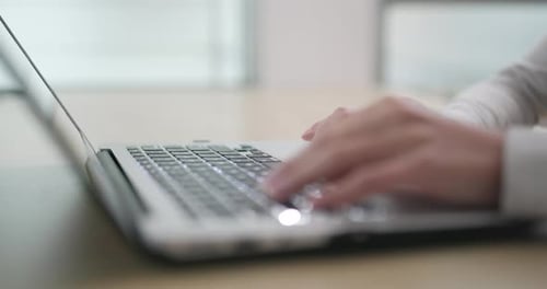 Woman working on laptop computer