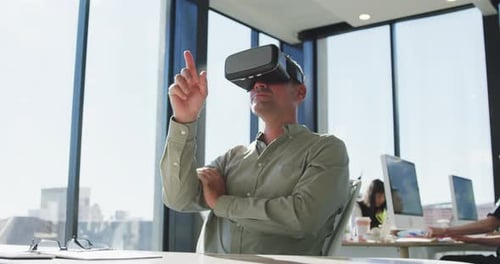 Man Uses VR Headset in Bright Modern Office