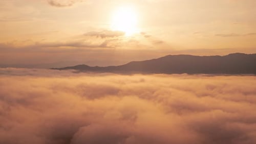 Dreamy Aerial View of Clouds at Sunrise