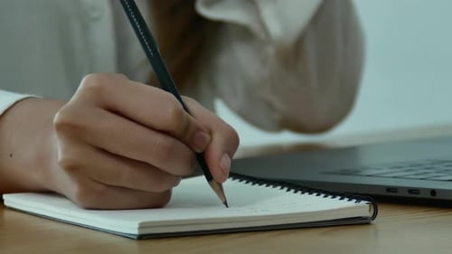 Typing on Laptop, Checking Phone and Taking Notes